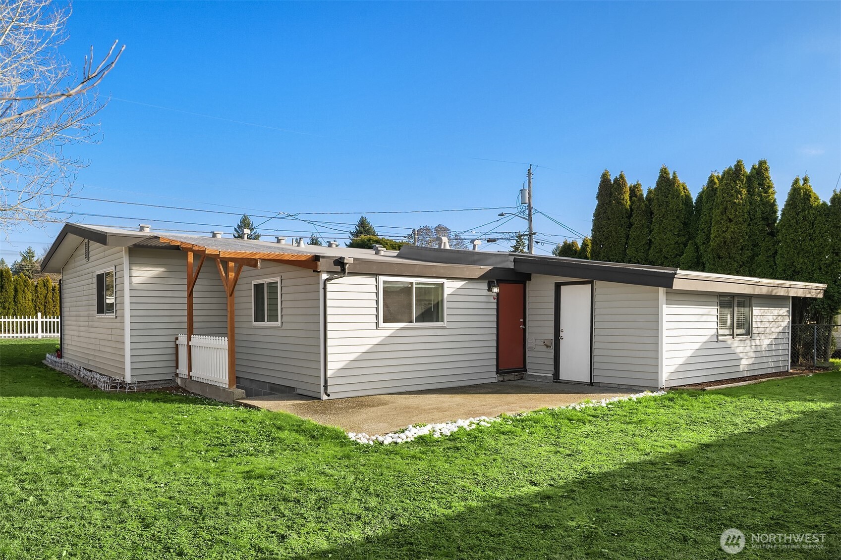 803 Dayton Avenue Northeast Renton, WA 98056 - Photo 12 of 13 a front view of a house with a yard