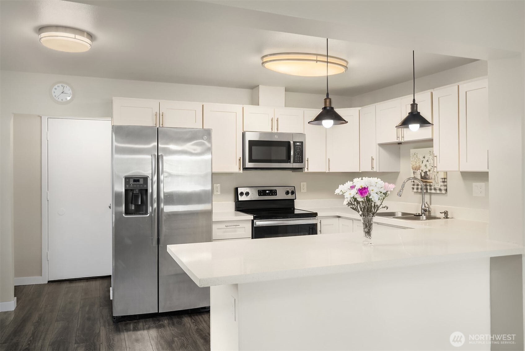 803 Dayton Avenue Northeast Renton, WA 98056 - Photo 5 of 13 a kitchen with kitchen island a counter space appliances and cabinets