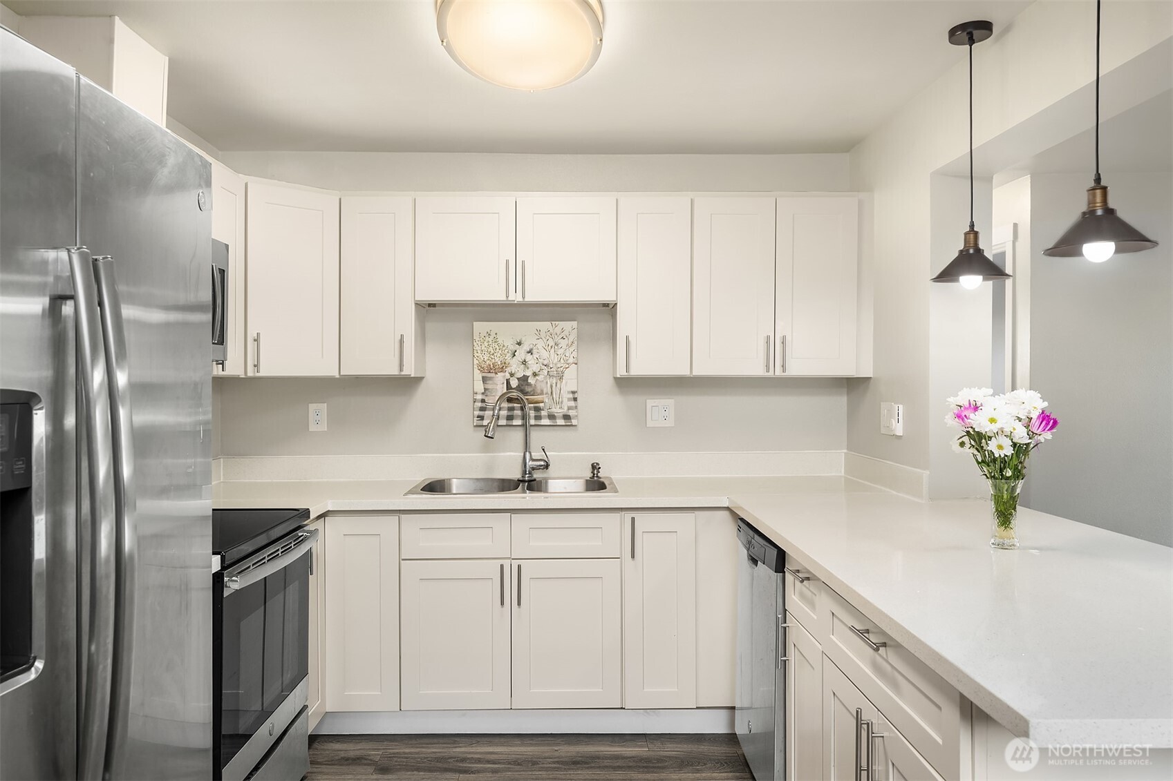 803 Dayton Avenue Northeast Renton, WA 98056 - Photo 6 of 13 a kitchen with kitchen island granite countertop a sink stainless steel appliances and cabinets