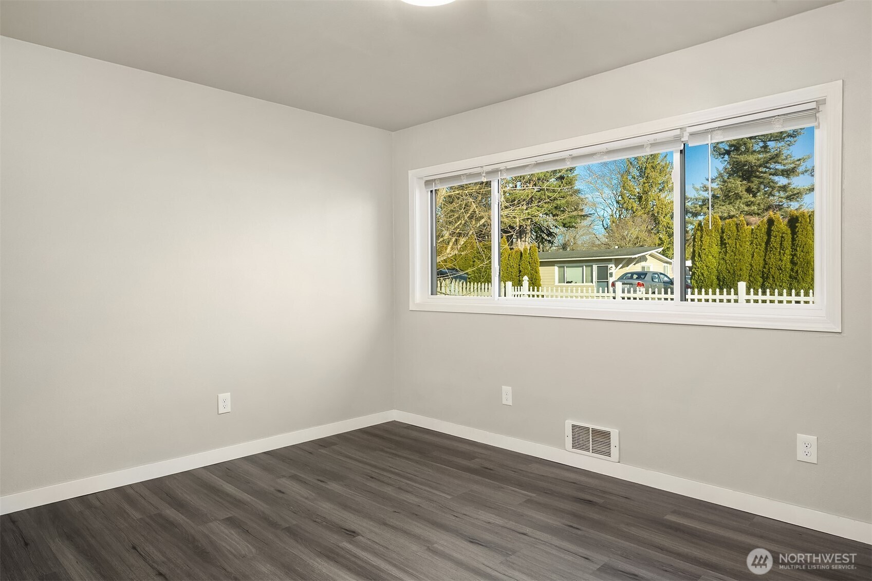 803 Dayton Avenue Northeast Renton, WA 98056 - Photo 9 of 13 a view of a small space with wooden floor and a window