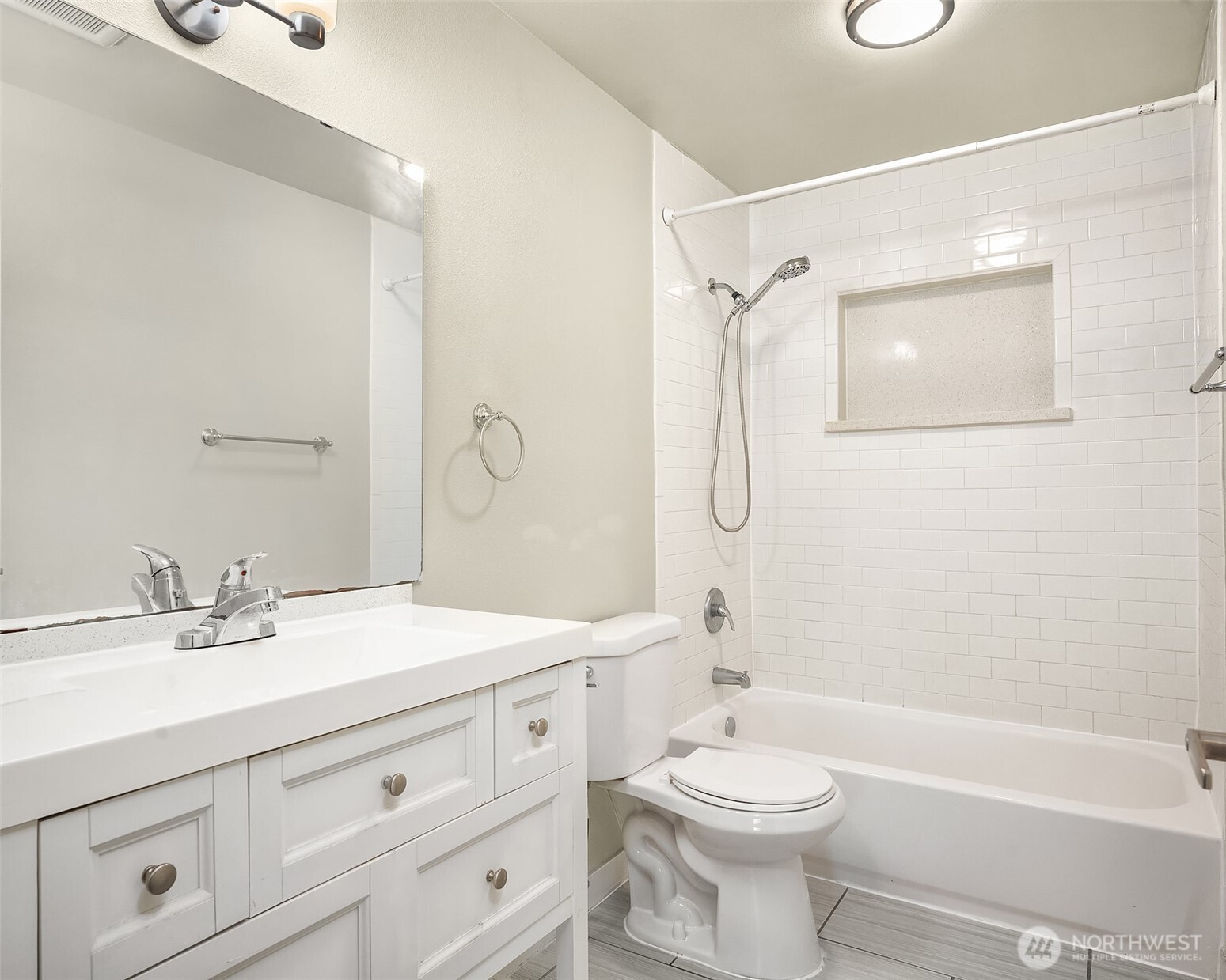 803 Dayton Avenue Northeast Renton, WA 98056 - Photo 10 of 13 a bathroom with a sink a toilet and shower