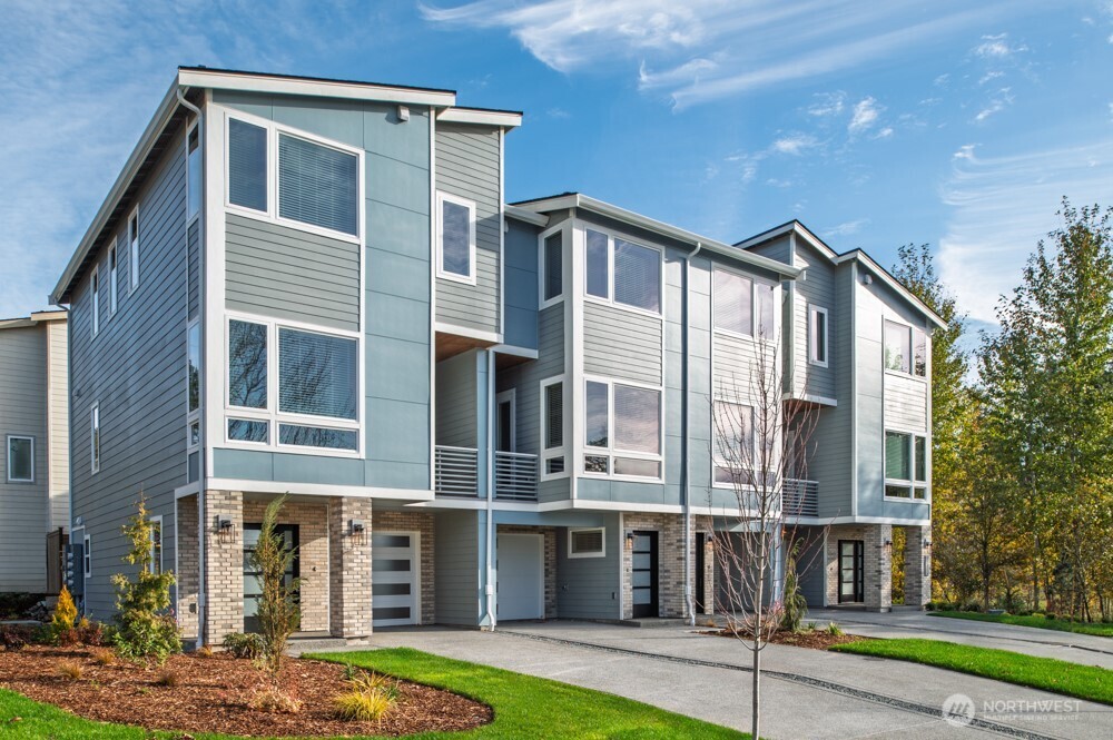 12814 66th Avenue South Seattle, WA 98178 - Photo 1 of 28 a front view of a house with a yard