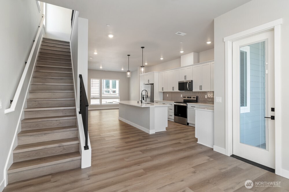 12814 66th Avenue South Seattle, WA 98178 - Photo 18 of 28 a view of kitchen with wooden floor and electronic appliances