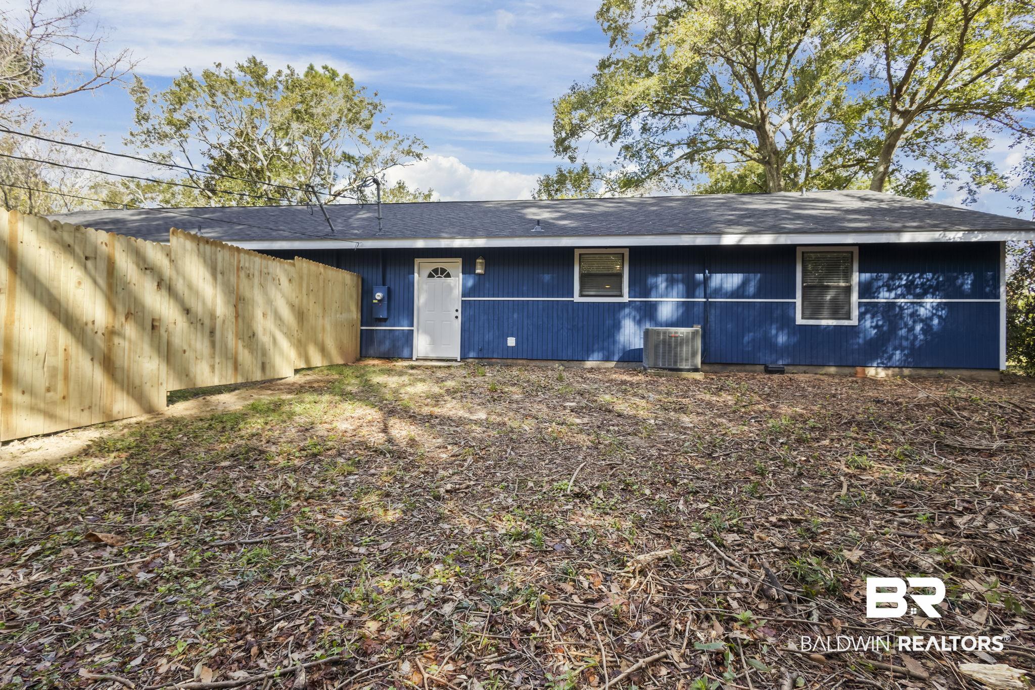 309 West Roosevelt Avenue Foley, AL 36535 - Photo 23 of 60 Back of house featuring central air condition unit