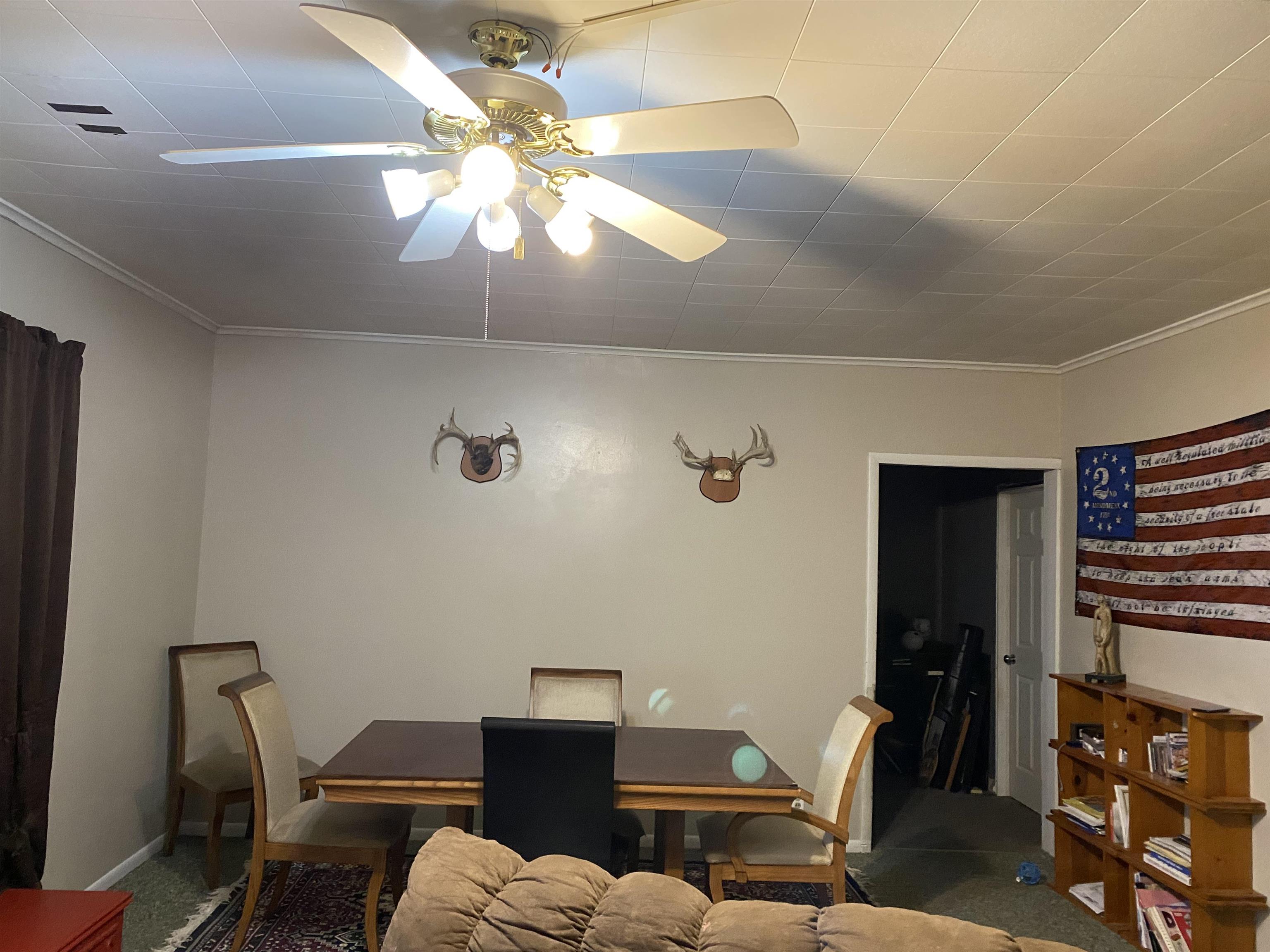 13448 Wacker Road Savanna, IL 61074 - Photo 11 of 11 a view of a dining room with furniture and wooden floor