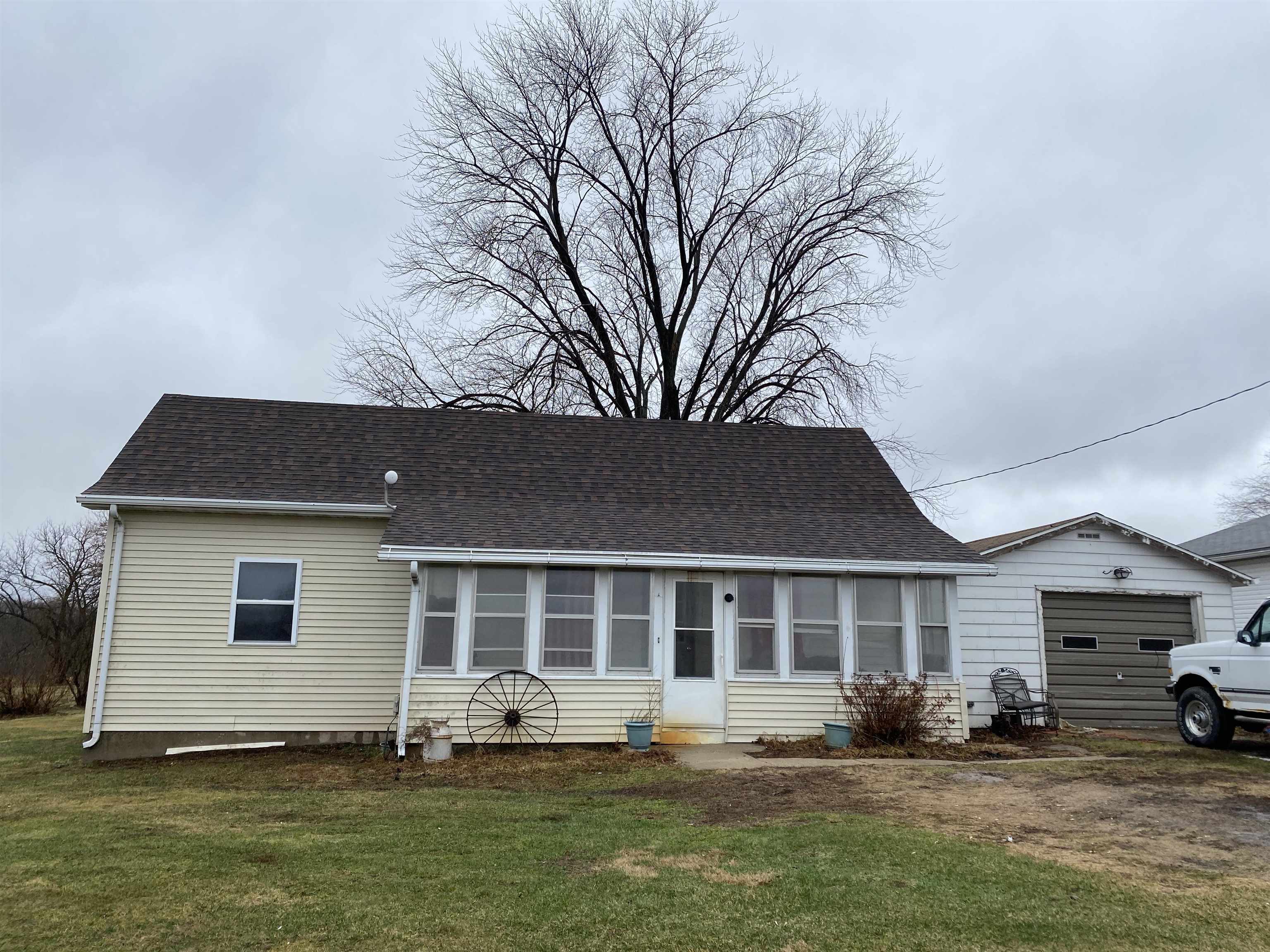 13448 Wacker Road Savanna, IL 61074 - Photo 2 of 11 a front view of a house with a yard and trees