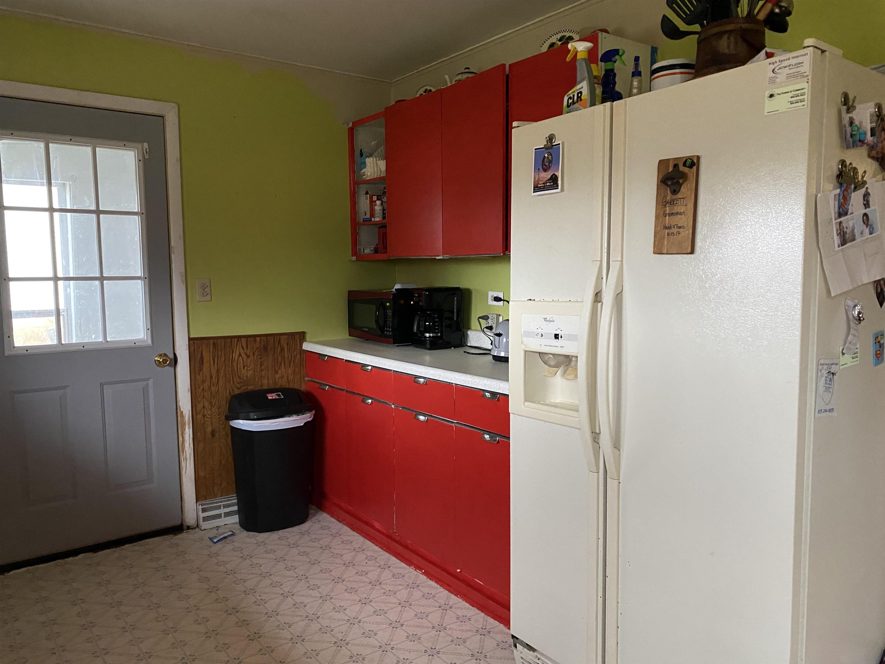 13448 Wacker Road Savanna, IL 61074 - Photo 7 of 11 a refrigerator freezer sitting inside of a kitchen