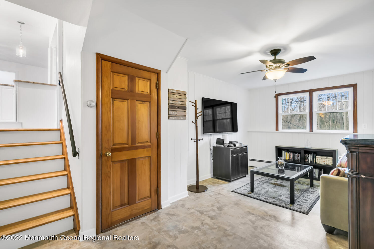 81 Dutch Lane Road Colts Neck, NJ 07722 - Photo 13 of 28 a living room with furniture a flat screen tv and a window