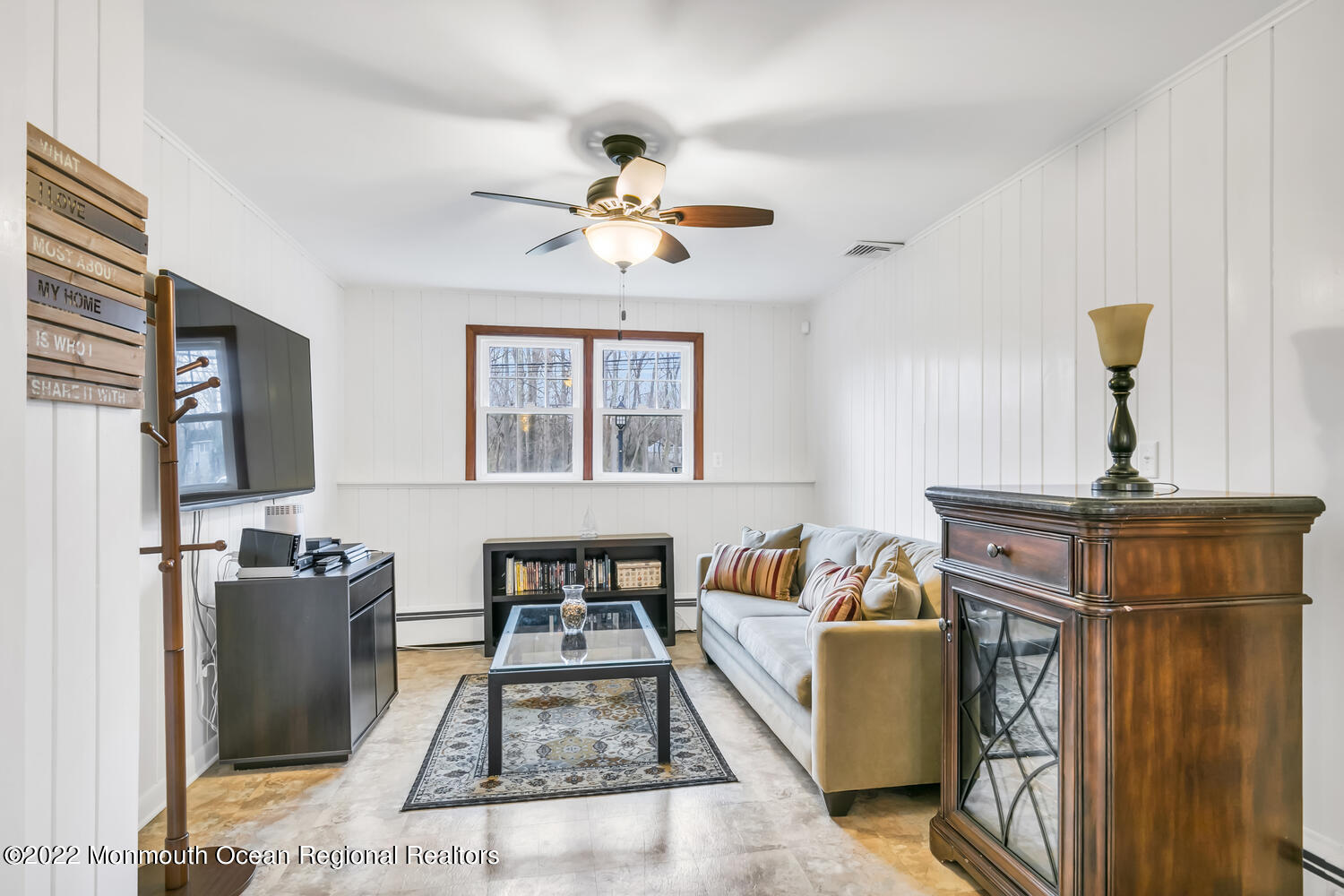 81 Dutch Lane Road Colts Neck, NJ 07722 - Photo 14 of 28 a living room with furniture a flat screen tv and a window