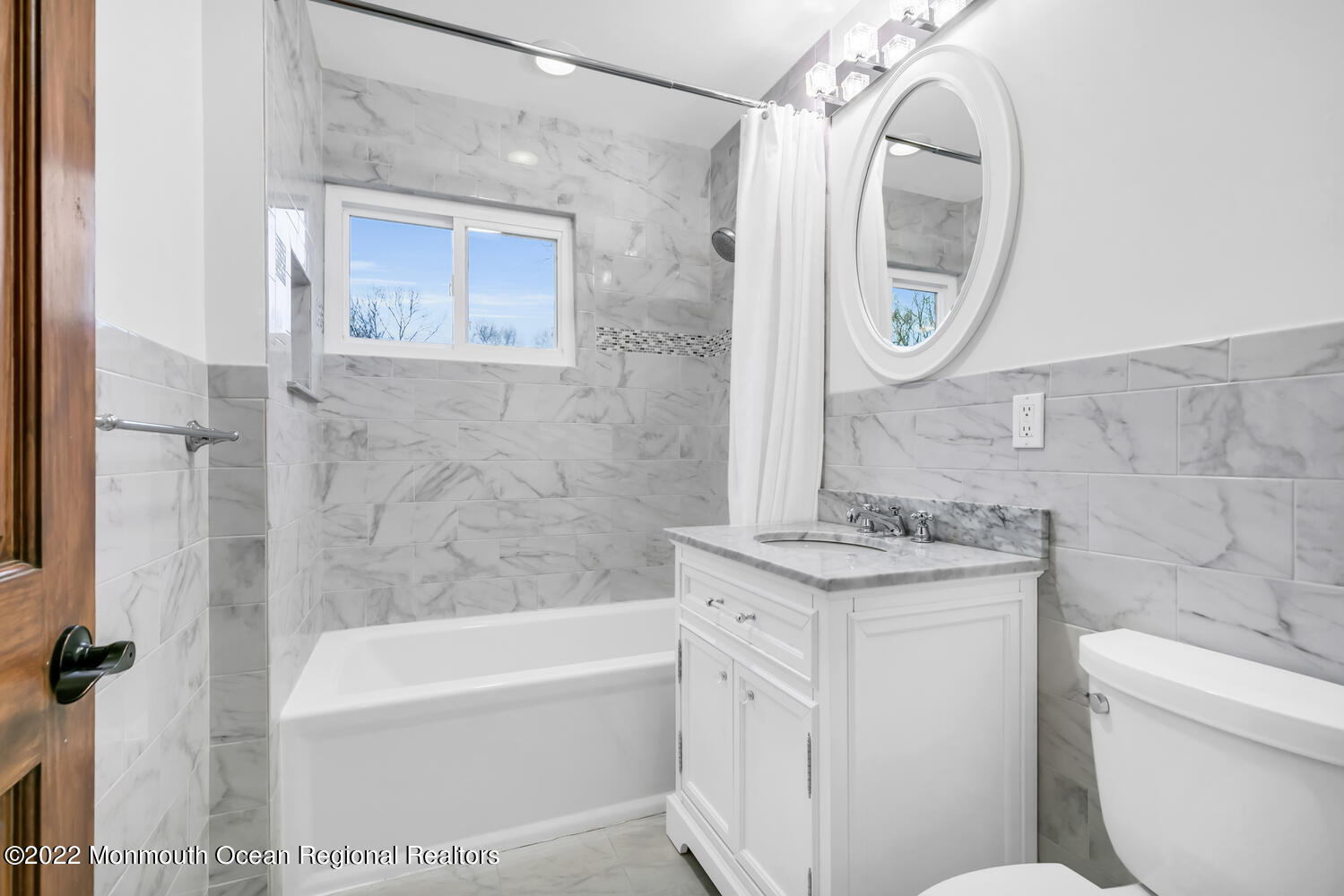 81 Dutch Lane Road Colts Neck, NJ 07722 - Photo 18 of 28 a bathroom with a granite countertop toilet a sink and a mirror
