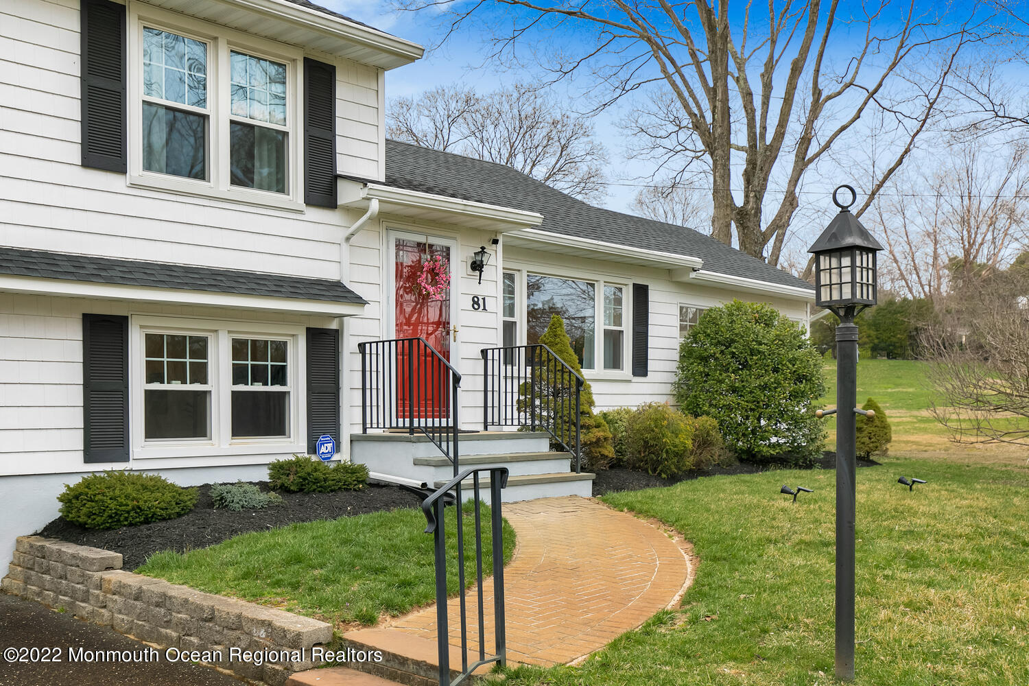 81 Dutch Lane Road Colts Neck, NJ 07722 - Photo 2 of 28 a front view of a house with garden