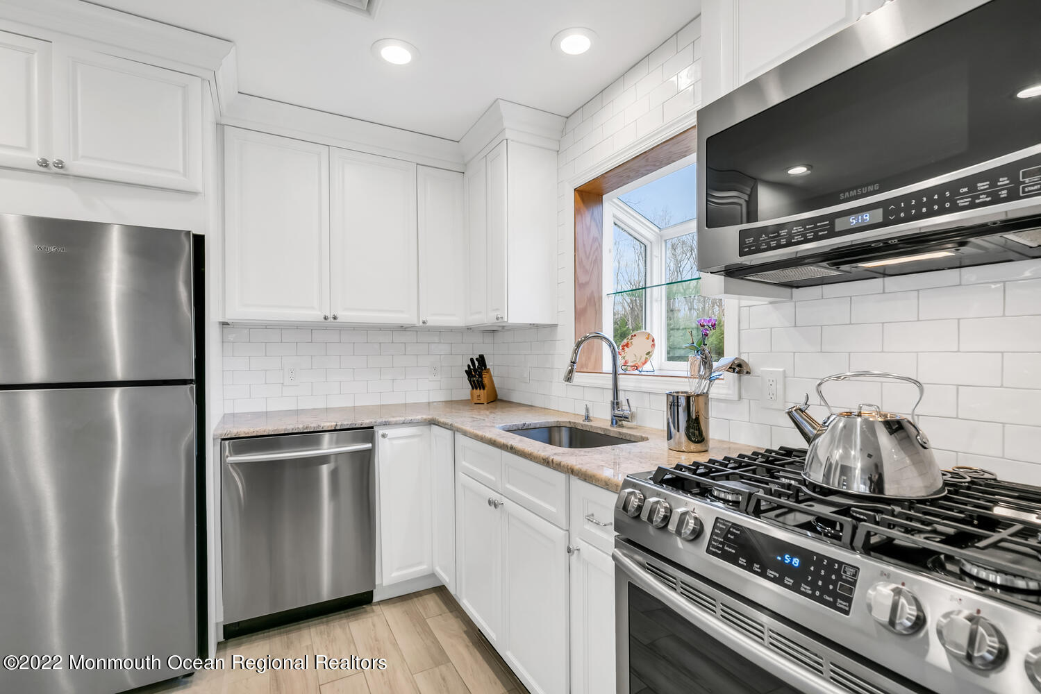 81 Dutch Lane Road Colts Neck, NJ 07722 - Photo 6 of 28 a kitchen with a stove and a refrigerator