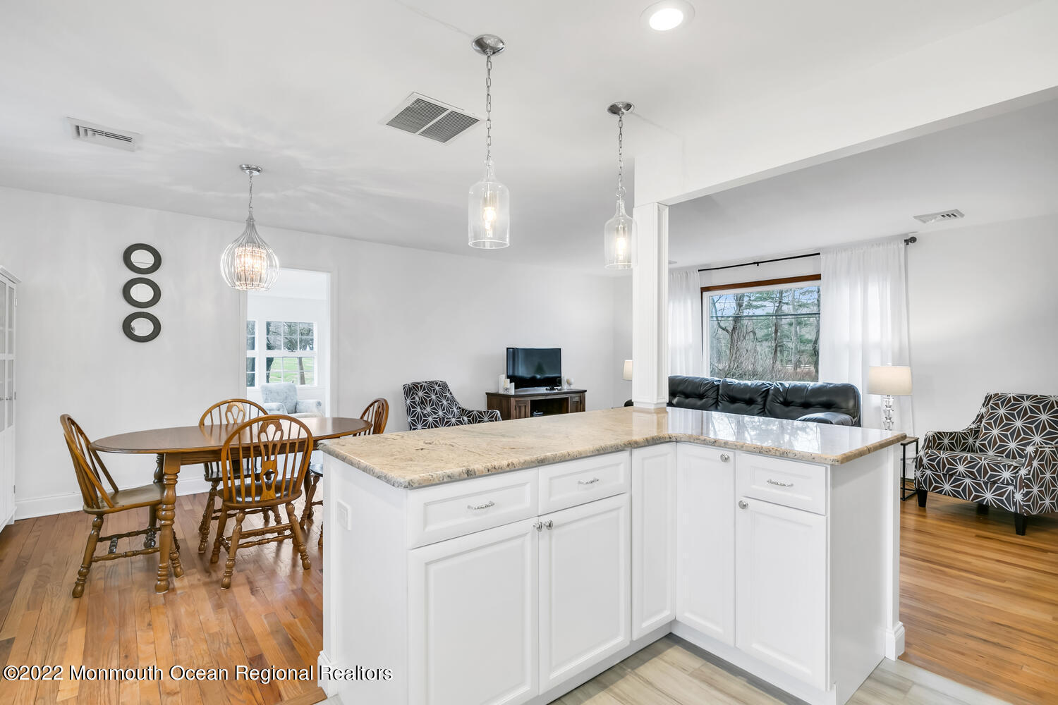 81 Dutch Lane Road Colts Neck, NJ 07722 - Photo 7 of 28 a kitchen with a stove a table and chairs in it