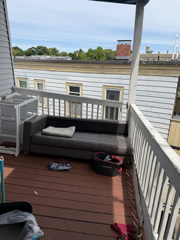 8 Ogden Street Boston, MA 02124 - Photo 18 of 20 a roof deck view with a lake view
