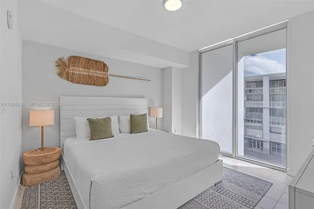 a bedroom with a bed and a lamp