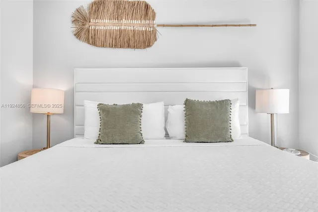 a view of a kitchen from the hallway with a room