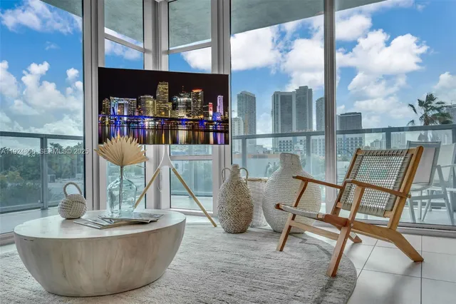 a view of a living room with a table and chair