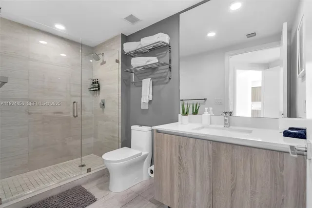 a bathroom with a shower and a toilet