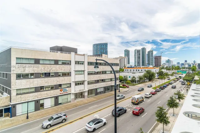 a view of city with ocean