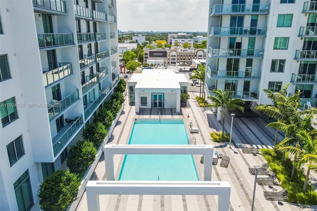 a view of a swimming pool with a lounge chairs