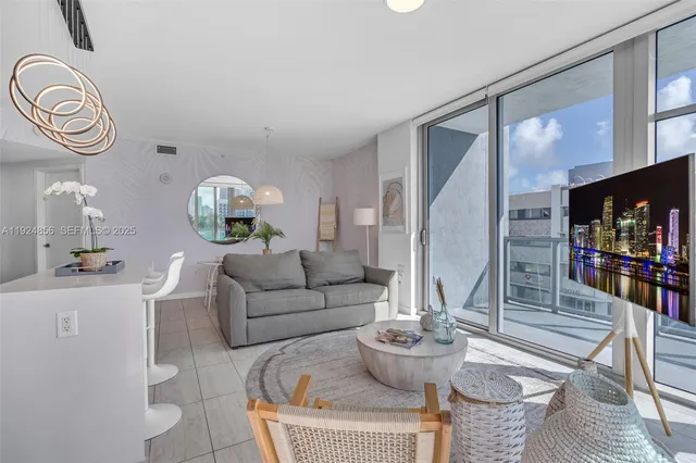 a living room with furniture and a large window