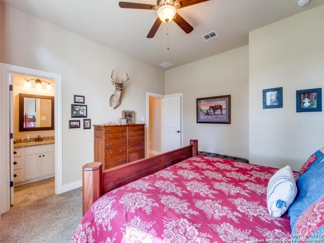 a bed room with a bed and a chandelier