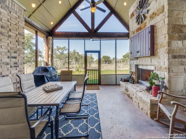 an aerial view of house with yard and swimming pool