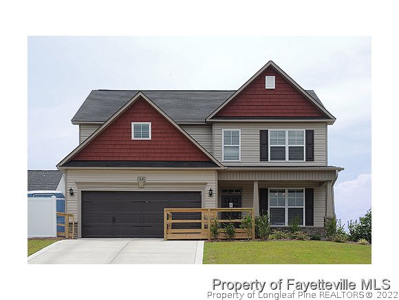52 Regimental Drive Cameron, NC 28326 - Photo 1 of 12 a front view of a house with garden