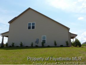 52 Regimental Drive Cameron, NC 28326 - Photo 11 of 12 a house view with a garden