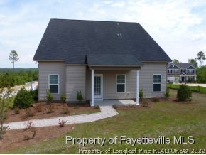 52 Regimental Drive Cameron, NC 28326 - Photo 12 of 12 a view of a house with a yard patio and fire pit