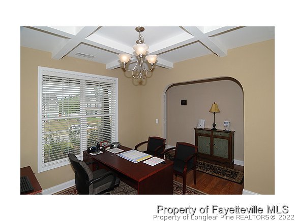 52 Regimental Drive Cameron, NC 28326 - Photo 2 of 12 a dining room with a table a chandelier and a window