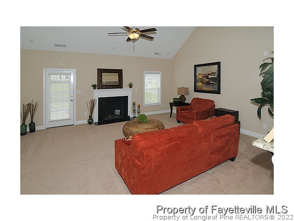 52 Regimental Drive Cameron, NC 28326 - Photo 4 of 12 a living room with furniture and a fireplace