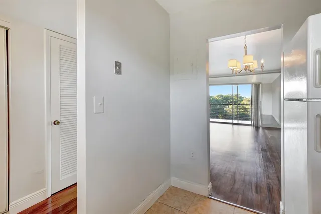 a bathroom with a granite countertop sink toilet mirror and shower