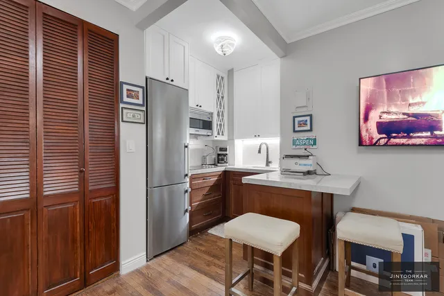 a kitchen with a refrigerator a sink and dishwasher