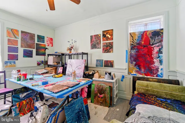 a view of a workspace with furniture and toys