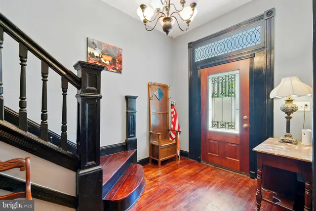 a view of hall way with furniture