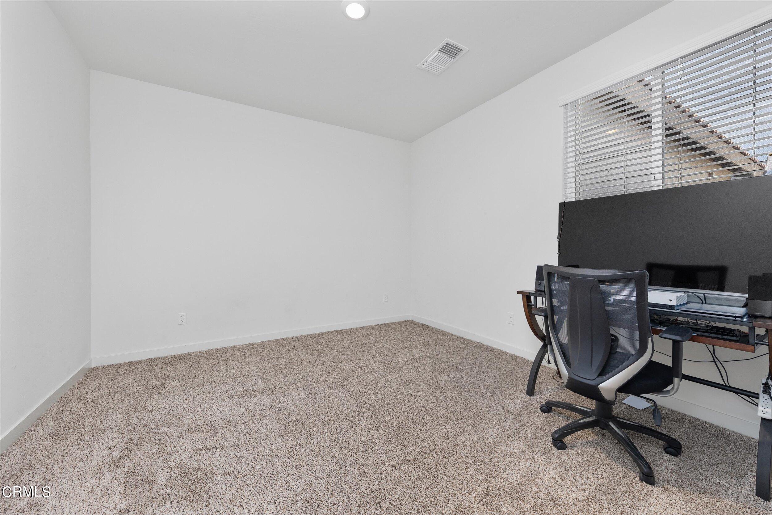 7405 Emerald Green Avenue Bakersfield, CA 93313 - Photo 17 of 39 a view of workspace with windows