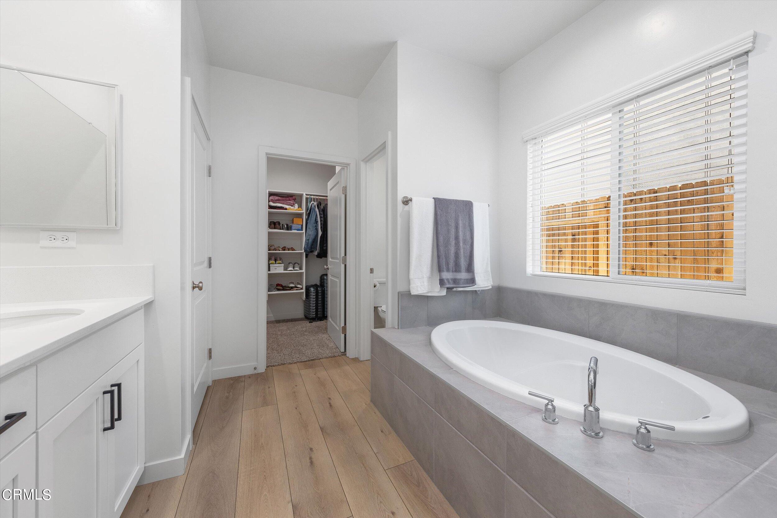 7405 Emerald Green Avenue Bakersfield, CA 93313 - Photo 23 of 39 a spacious bathroom with sink shower and bathtub