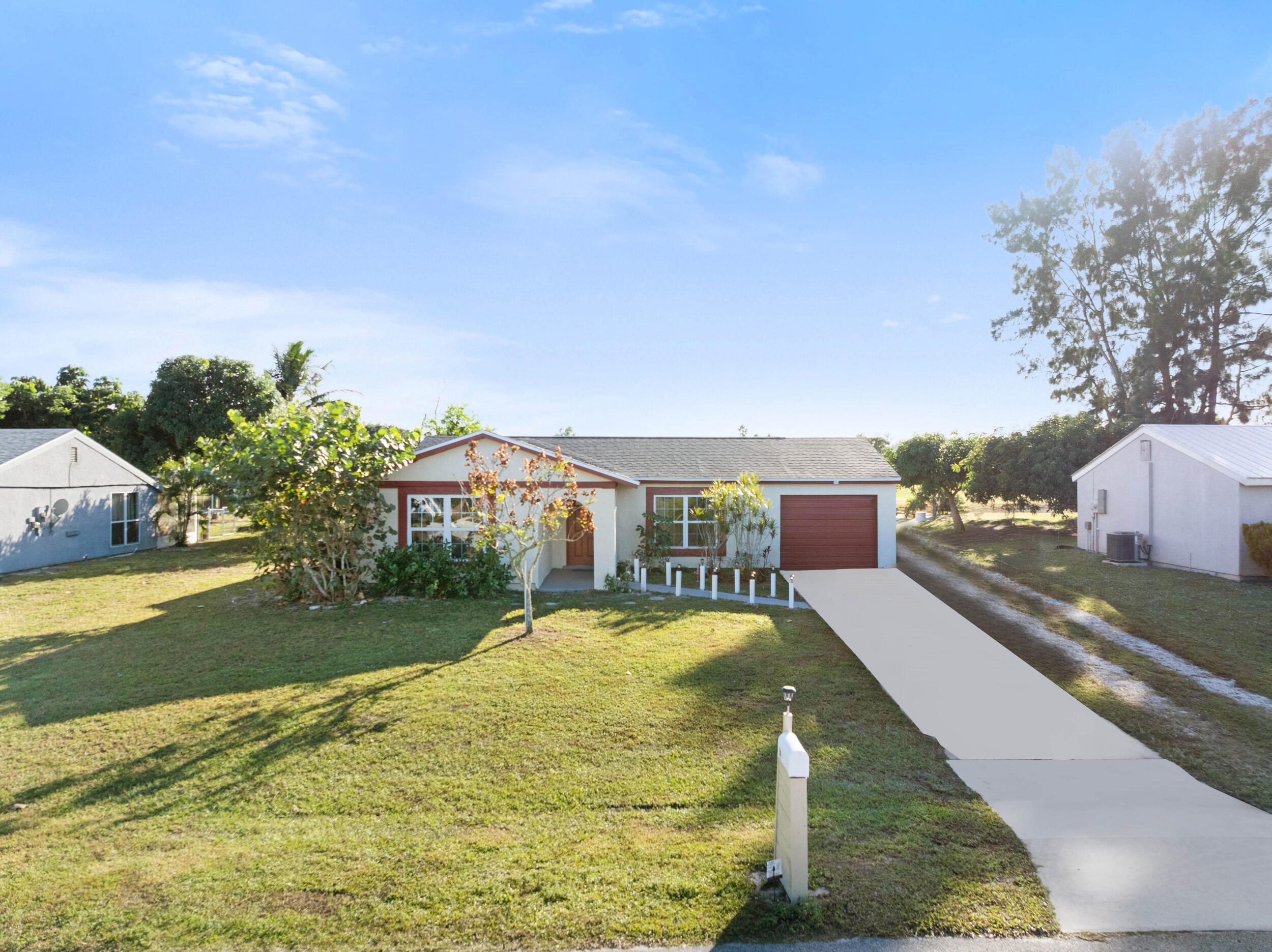 244 Southwest Cherryhill Road Port St. Lucie, FL 34953 - Photo 3 of 39 1_dji_20251201234708_0791_d