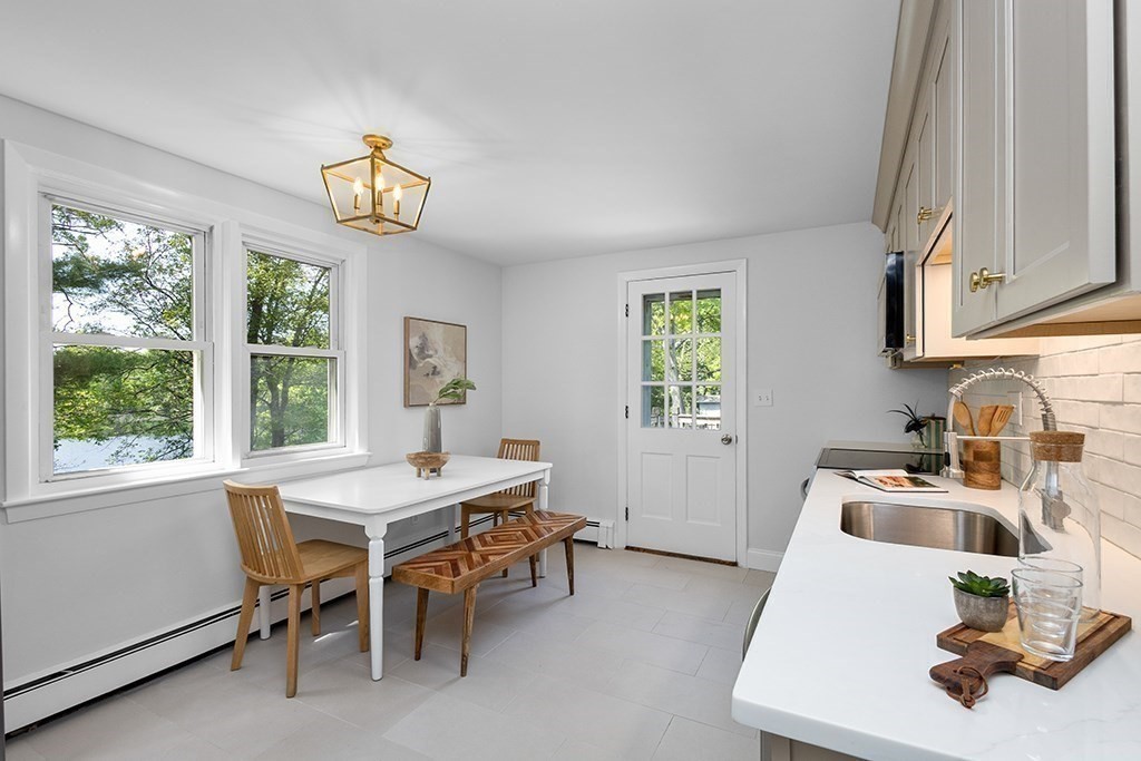 117 Oak Ridge Drive Ayer, MA 01432 - Photo 7 of 26 a view of a dining room with furniture window and outside view
