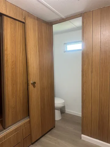 a bathroom with a toilet a sink and a shower