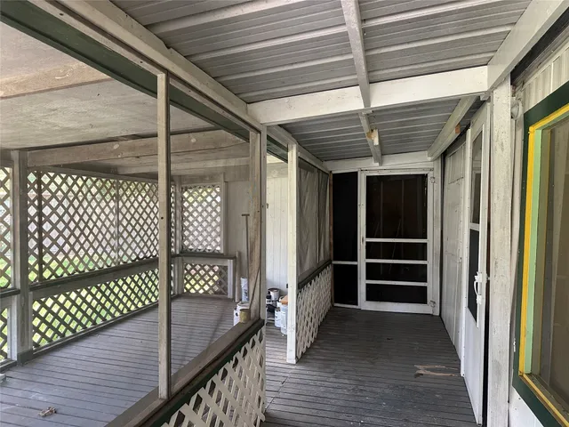 a view of outdoor space with wooden floor