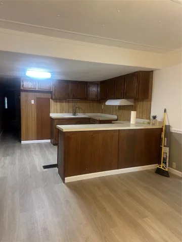 a view of a kitchen with a sink