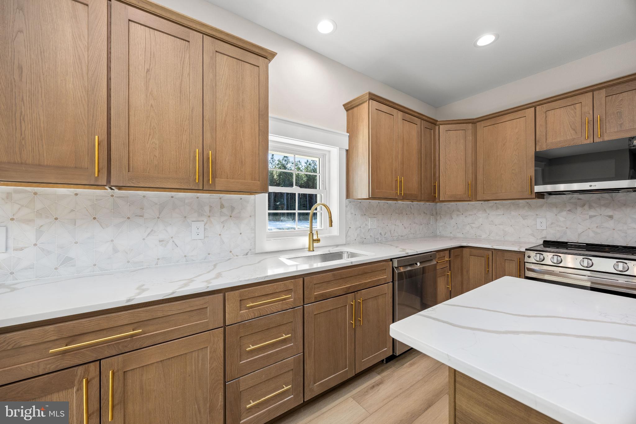 19438 Parsons Road Georgetown, DE 19947 - Photo 13 of 62 Modern kitchen with elegant wood cabinetry.