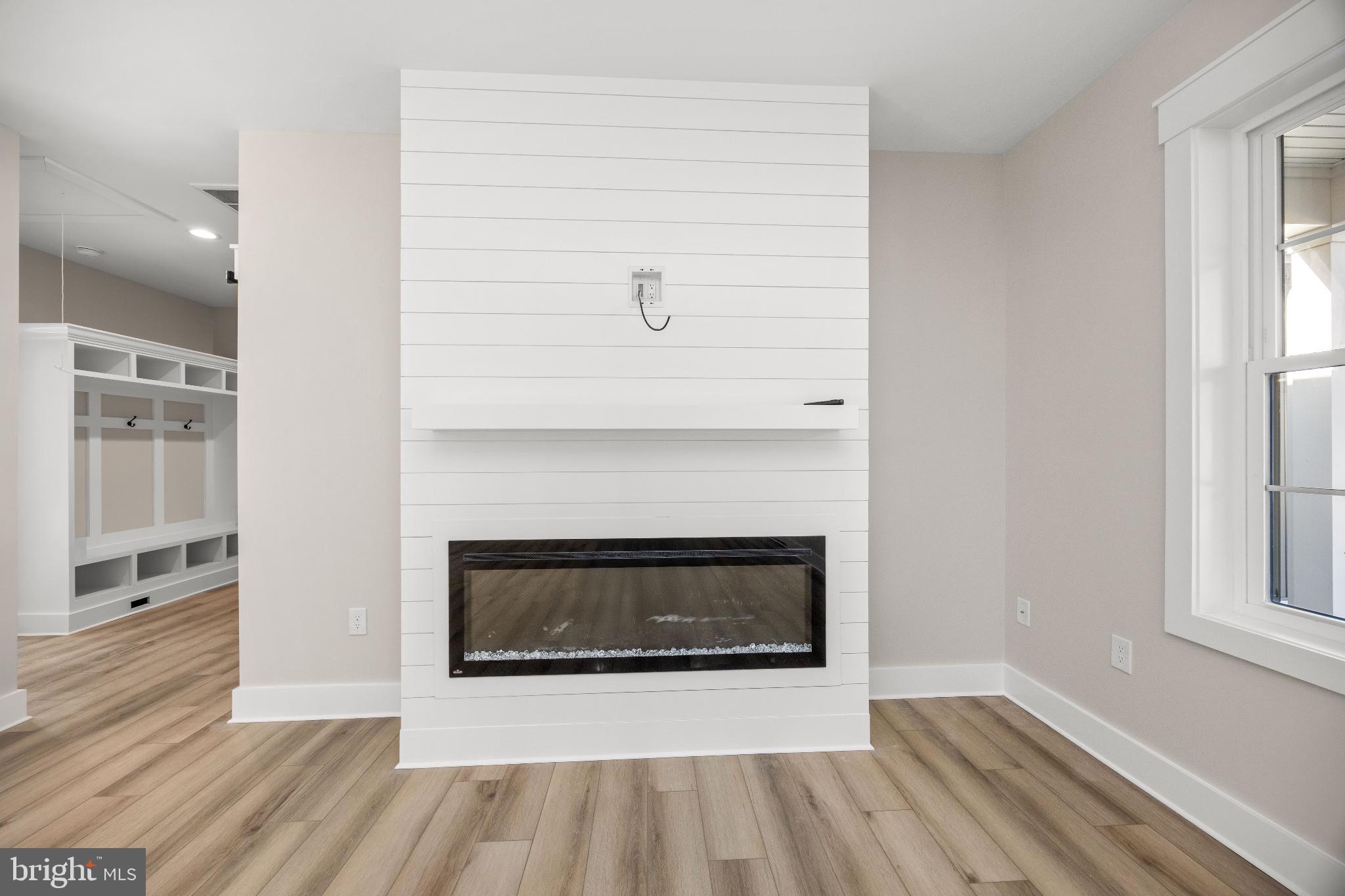 19438 Parsons Road Georgetown, DE 19947 - Photo 18 of 62 Modern elegance with a cozy fireplace.