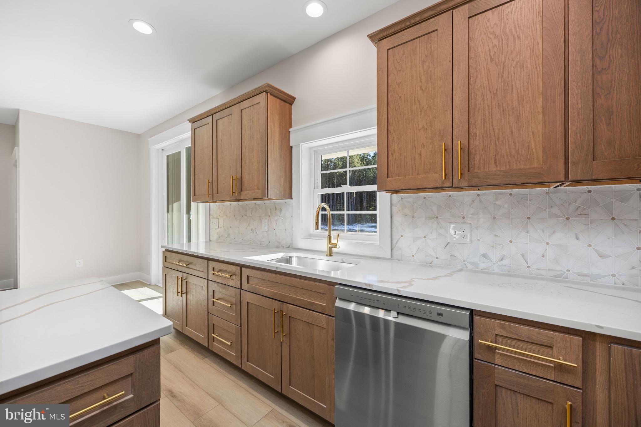 19438 Parsons Road Georgetown, DE 19947 - Photo 23 of 62 Modern kitchen with elegant wood cabinetry.