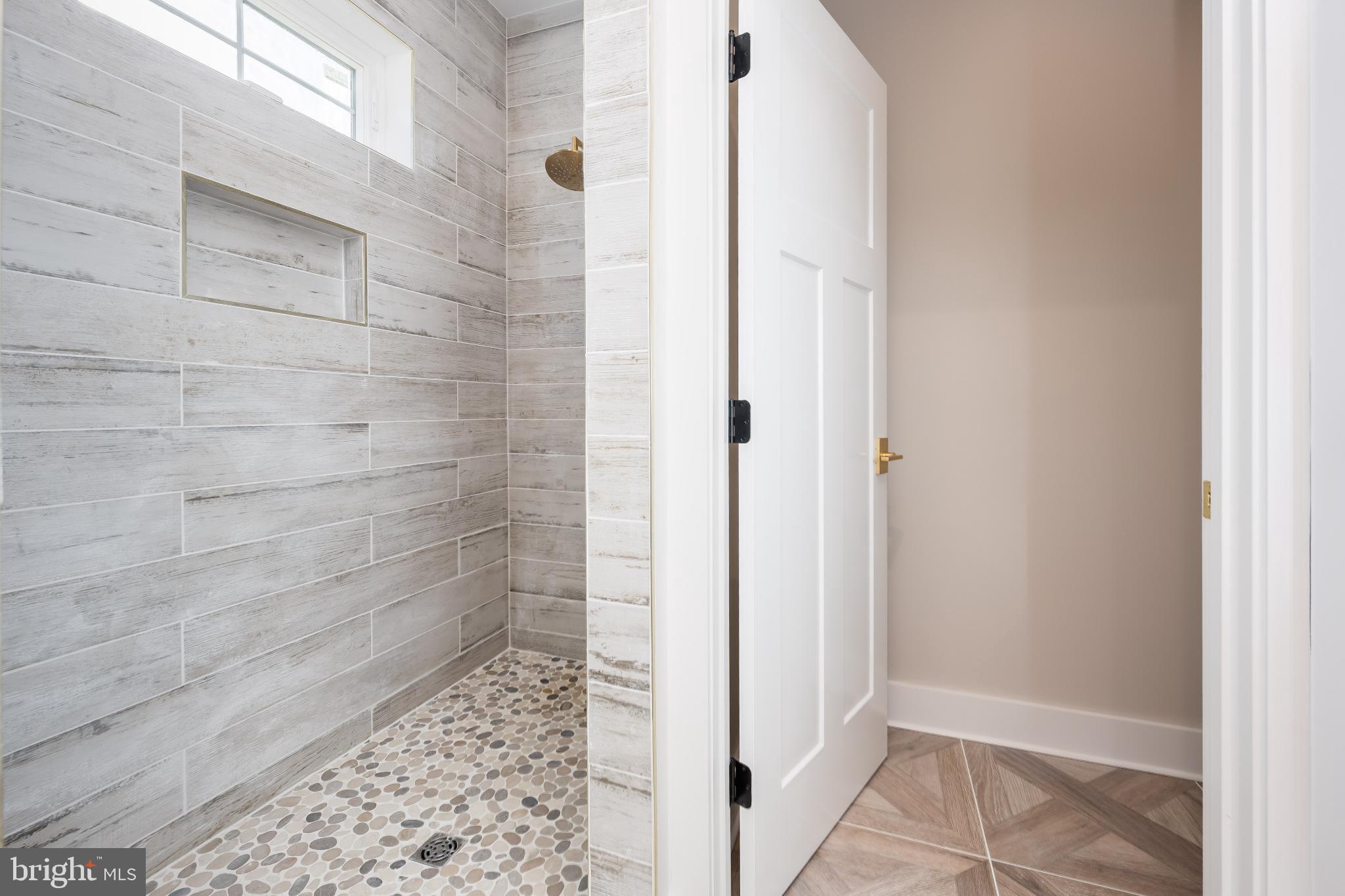 19438 Parsons Road Georgetown, DE 19947 - Photo 36 of 62 Elegant shower space with modern finishes.