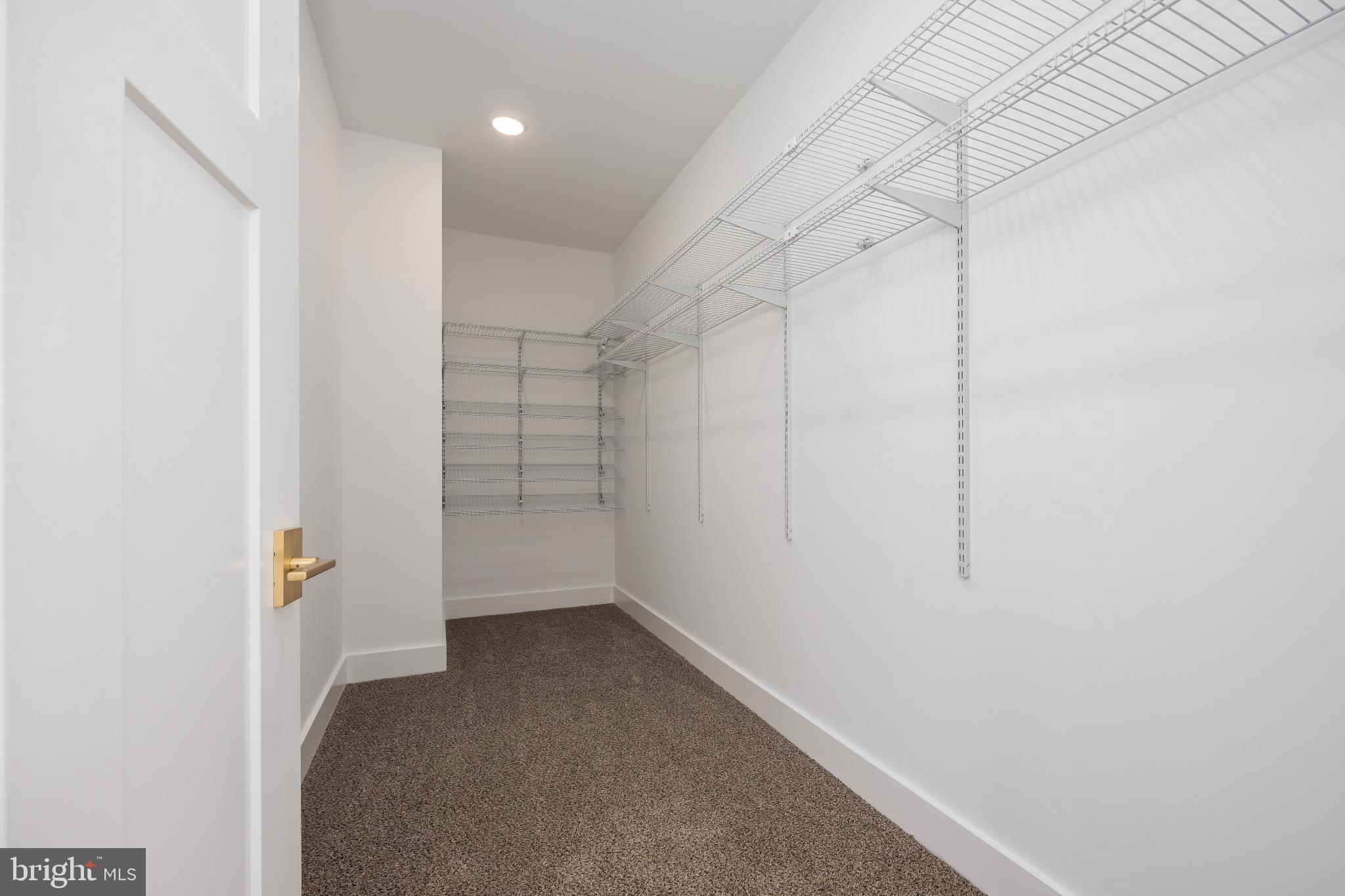 19438 Parsons Road Georgetown, DE 19947 - Photo 39 of 62 Spacious, organized closet ready for your style.