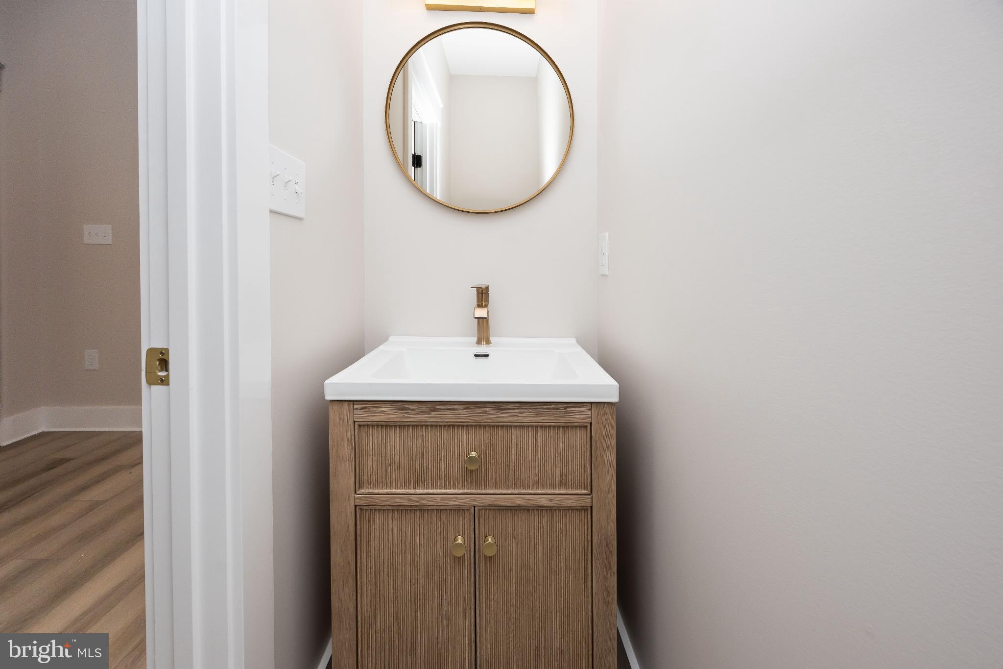 19438 Parsons Road Georgetown, DE 19947 - Photo 41 of 62 Sleek vanity with modern elegance.