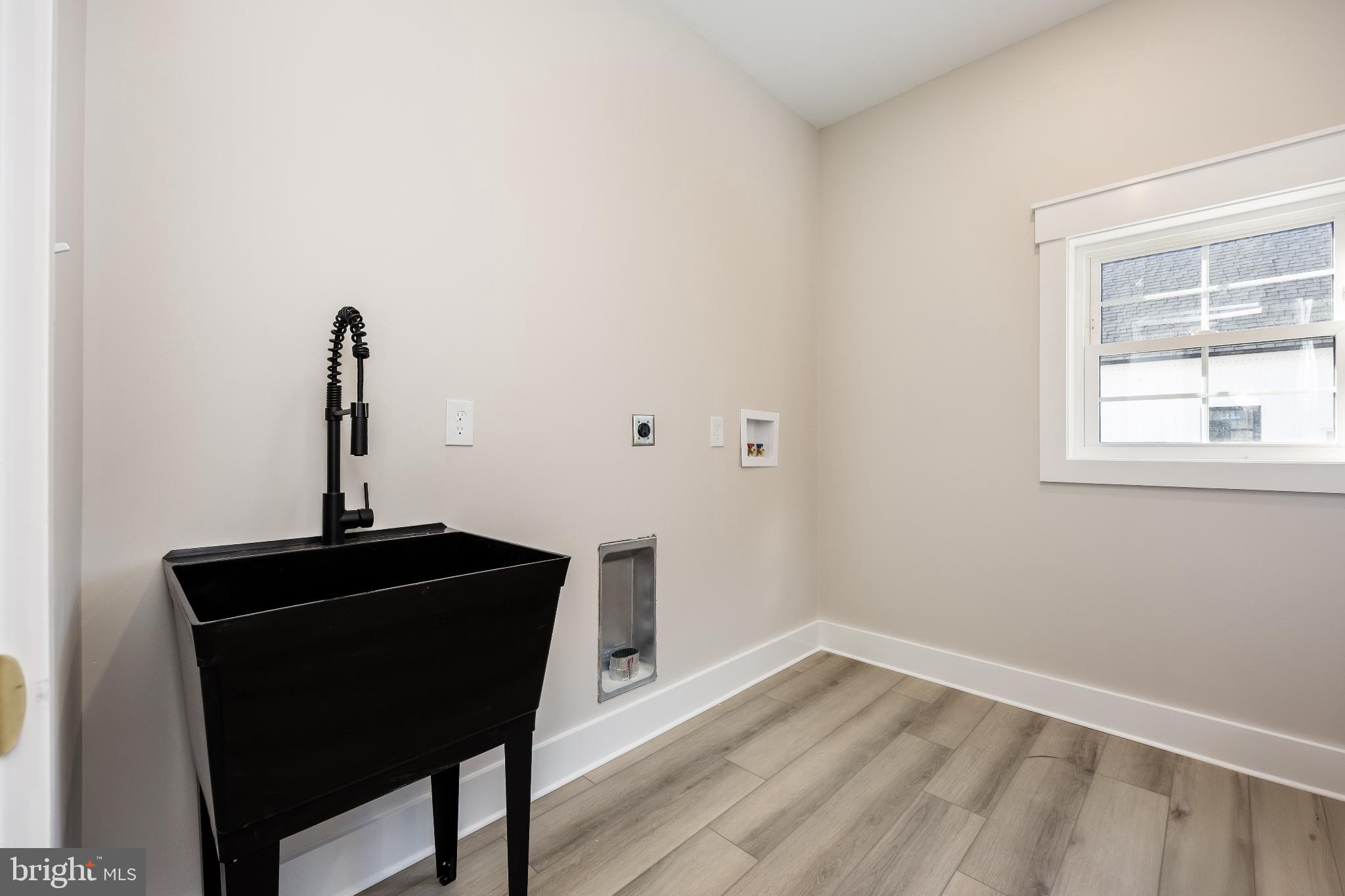 19438 Parsons Road Georgetown, DE 19947 - Photo 42 of 62 Sleek utility space with modern fixtures.